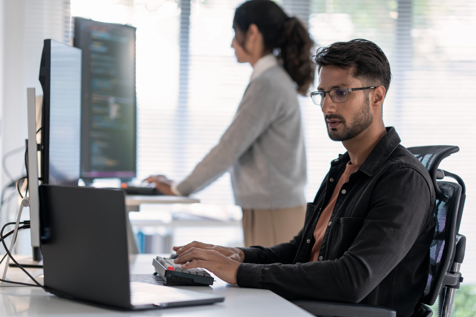Cybersecurity analyst reviewing threat protection and monitoring workflows