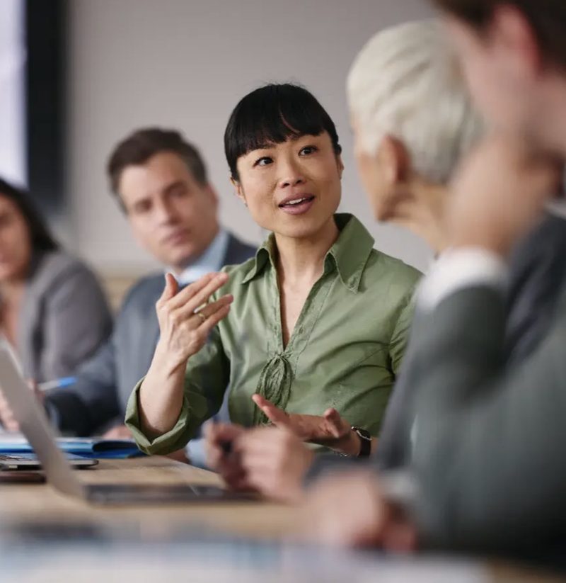 Leadership discussing AI governance in a boardroom